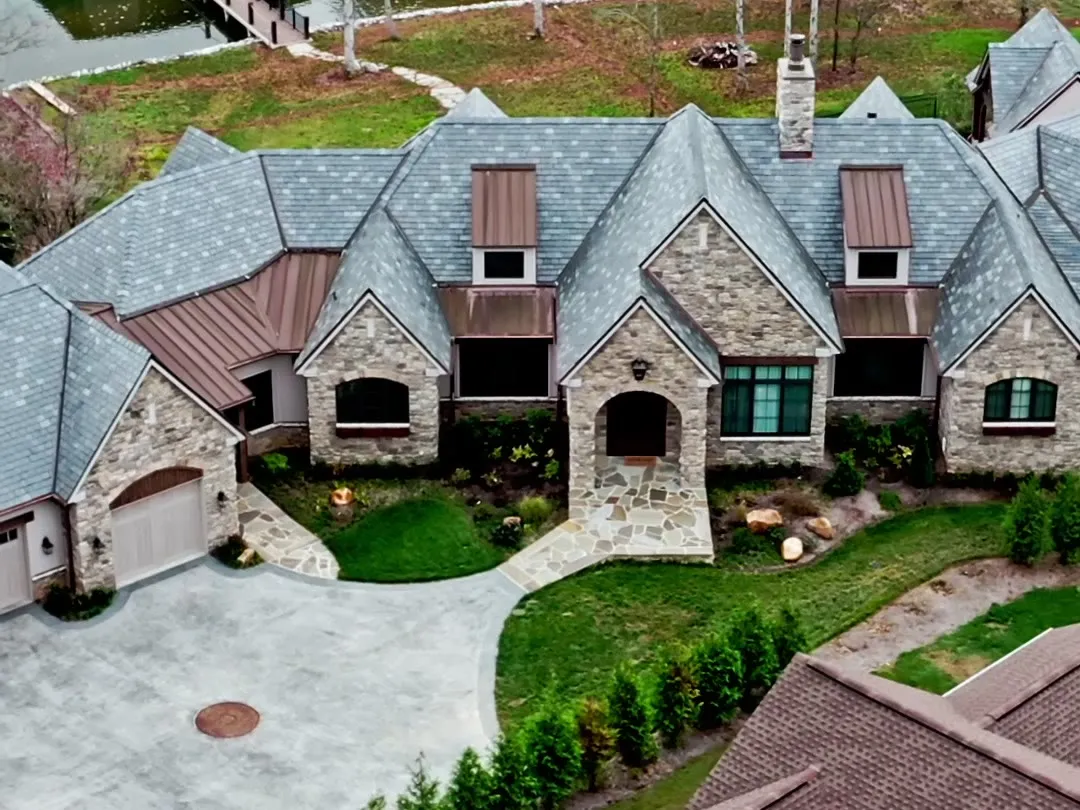 The Stonebridge Manor, a lakefront stone home with a private dock